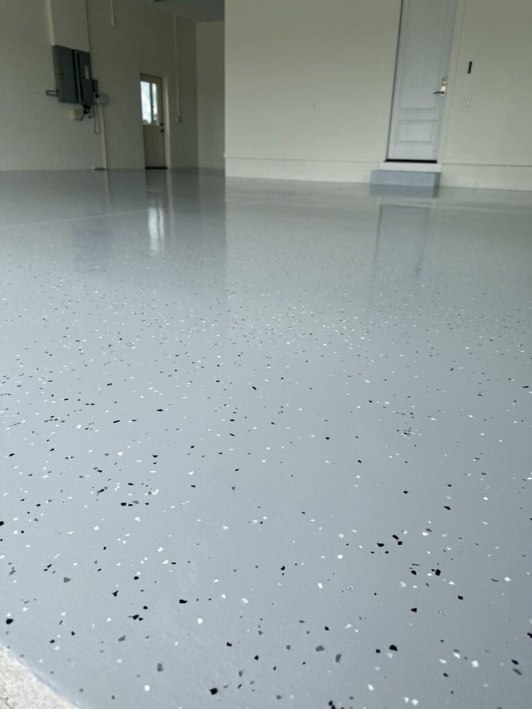 A room with a floor that has been painted white.