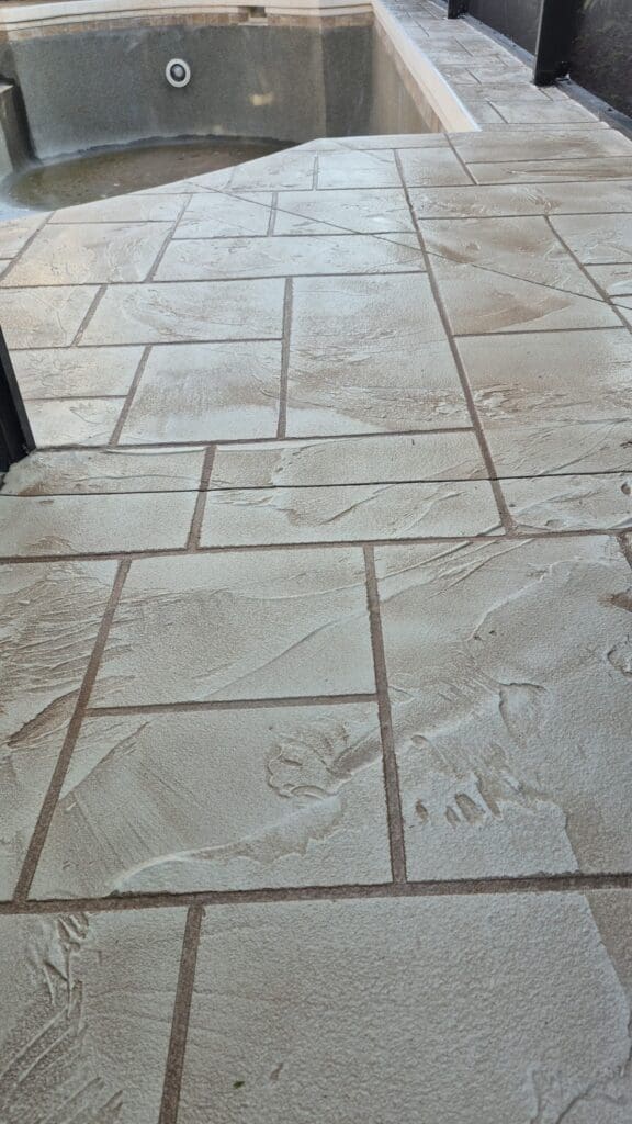 Textured pool deck resurfacing in Sarasota FL by U-Plus Me featuring slip-resistant cool deck finish designed for Florida heat and rain